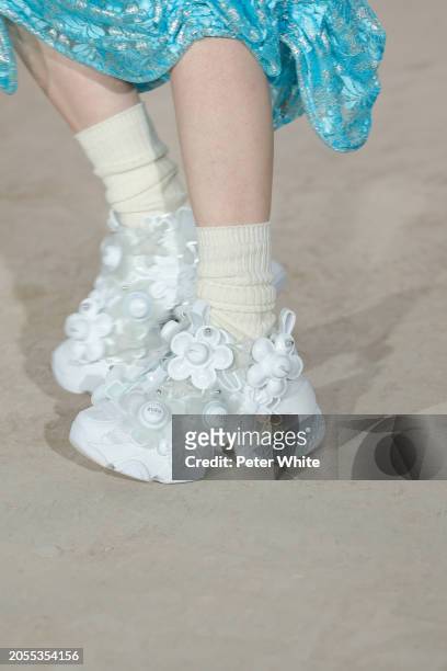 Model, shoe detail, walks the runway during the Noir Kei Ninomiya Womenswear Fall/Winter 2024-2025 show as part of Paris Fashion Week on March 02,...