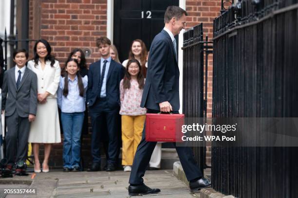 Chancellor of the Exchequer, Jeremy Hunt, is seen outside 11 Downing Street with his ministerial box before delivering his Budget in the Houses of...