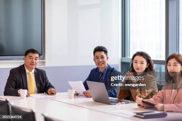 business colleagues discussing in the meeting room - old shanghai stock pictures, royalty-free photos & images