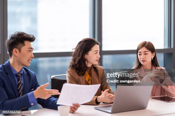 business colleagues discussing in the meeting room - businesswear stock pictures, royalty-free photos & images