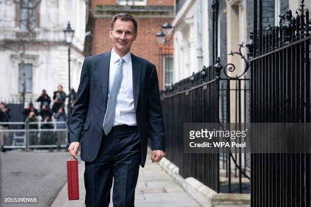 Chancellor of the Exchequer, Jeremy Hunt, leaves 11 Downing Street with his ministerial box before delivering his Budget in the Houses of Parliament...