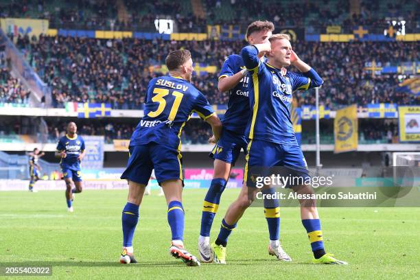 Karol Swiderski of Hellas Verona FC celebrates scoring his team's first goal with teammates during the Serie A TIM match between Hellas Verona FC and...