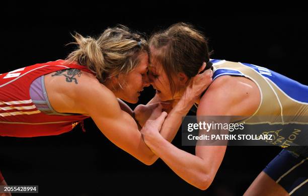 Roksana Zasina from Poland fights with Ekaterina Krasnova from Russia in the qualification round of the European Wrestling Championship 51 kg...