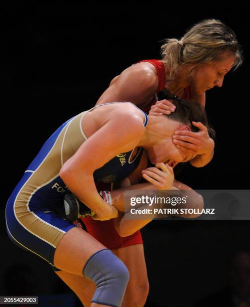 Roksana Zasina from Poland fights with Ekaterina Krasnova from Russia in the qualification round of the European Wrestling Championship 51 kg...