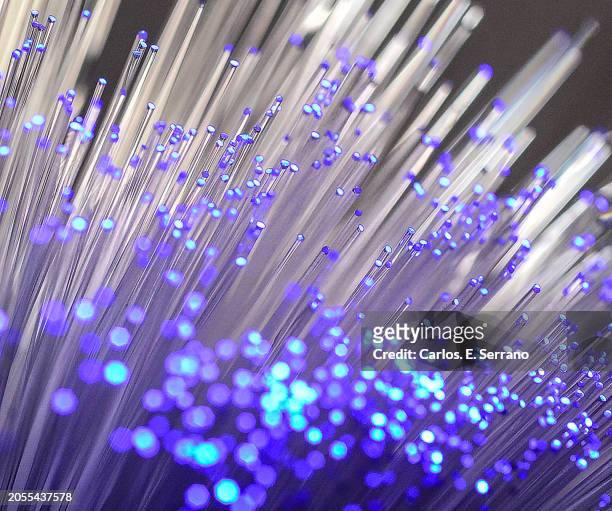 fiber optics tubes illuminated in soft purple blue tips - yonkers stock pictures, royalty-free photos & images