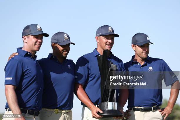 Bryson DeChambeau ,Paul Casey,Charles Howell III and Anirban Lahiri of Crushers GC poses with the team trophy after day three of the LIV Golf...