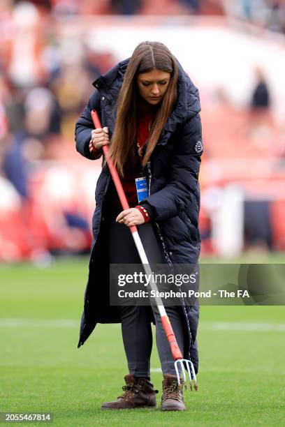 Member of the Ground Staff Team tends to the pitch at half time during the Barclays Women's Super League match between Arsenal FC and Tottenham...