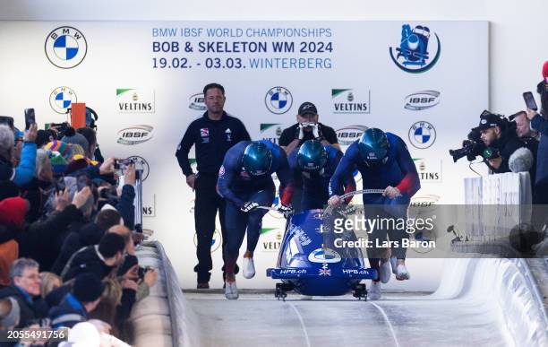 Brad Hall, Leon Greenwood, Taylor Lawrence and Greg Cackett of Great Britain compete during their third run of the 4-man Bobsleigh competition at the...