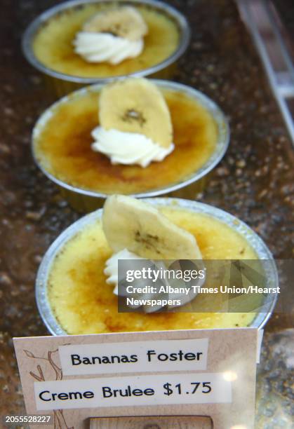 Bananas foster creme brulee in a case at Cake Street Sweets shop on Remsen St. On Thursday, July 6, 2017 in Cohoes, N.Y.