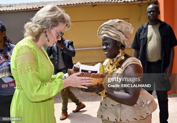 Queen Mathilde of Belgium receives a guided tour at a visit of ECAM cocoa cooperative in Meagui, during a royal working visit to Ivory Coast, in San...