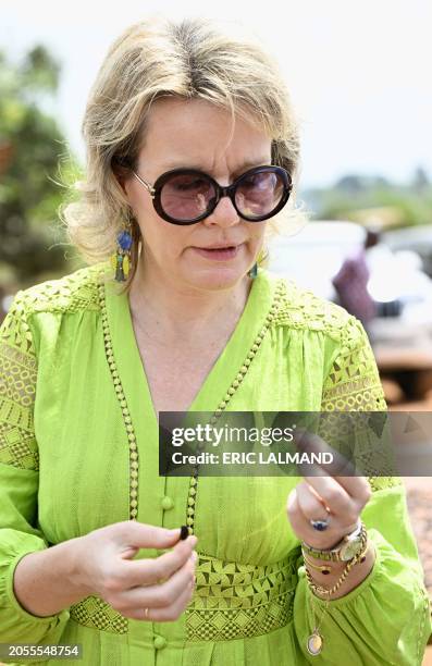 Queen Mathilde of Belgium has a taste at a visit of ECAM cocoa cooperative in Meagui, during a royal working visit to Ivory Coast, in San Pedro,...