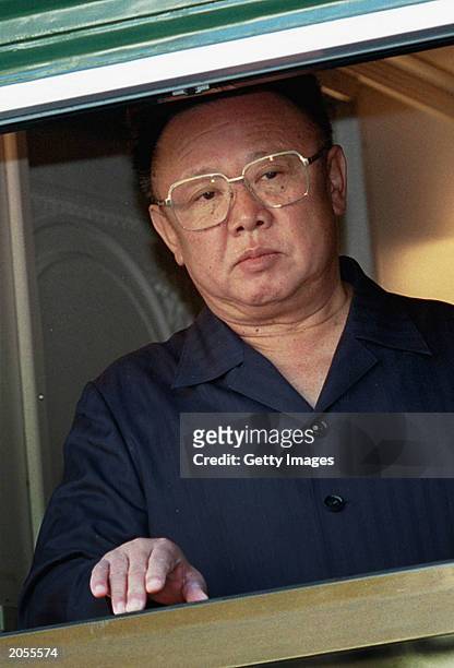 North Korean leader Kim Jong Il looks out of a window from his armored train at a Russian border railway station in Khasan, Far East Russia, August...
