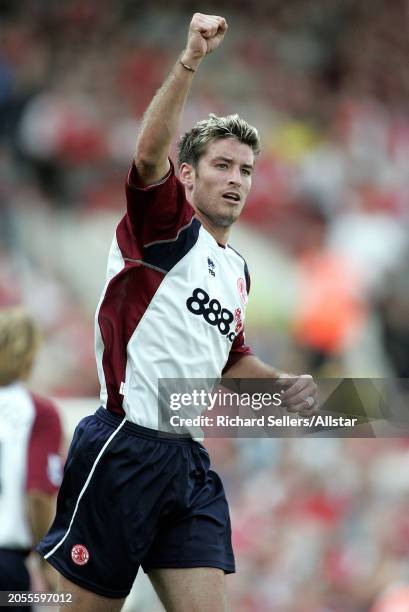 August 22: Franck Queudrue of Middlesbrough celebrates during the Premier League match between Arsenal and Middlesbrough at Highbury on August 22,...