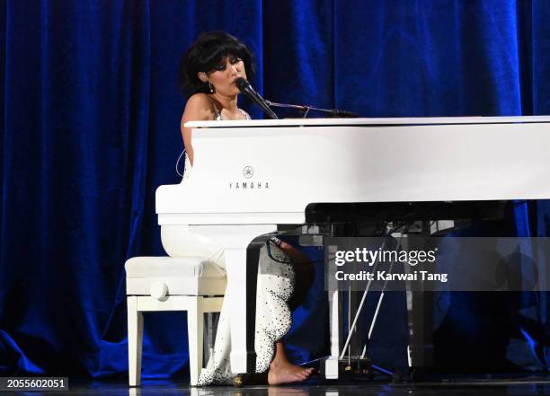 Raye performs on stage during the BRIT Awards 2024 at The O2 Arena on March 02, 2024 in London, England.