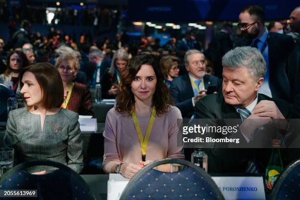 Maia Sandu, Moldova's president, left, Isabel Diaz Ayuso, president of the Madrid region, center, and Petro Poroshenko, Ukraine's former president,...