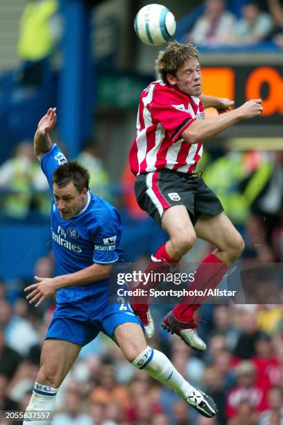 August 28: James Beattie of Southampton and John Terry of Chelsea heading during the Premier League match between Chelsea and Southampton at Stamford...