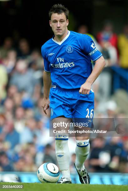 August 28: John Terry of Chelsea on the ball during the Premier League match between Chelsea and Southampton at Stamford Bridge on August 28, 2004 in...
