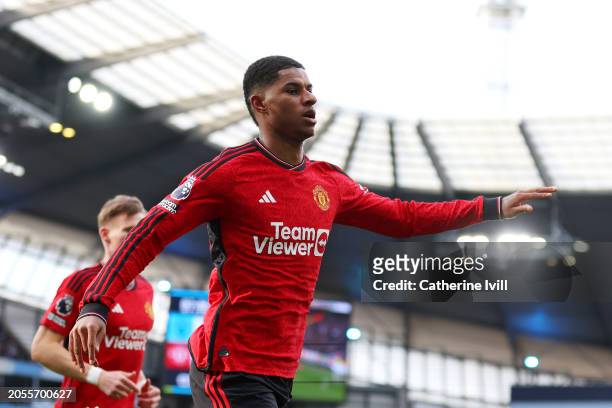 Marcus Rashford of Manchester United celebrates scoring his team's first goal during the Premier League match between Manchester City and Manchester...
