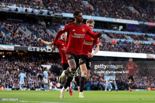 Marcus Rashford of Manchester United celebrates scoring his team's first goal during the Premier League match between Manchester City and Manchester...