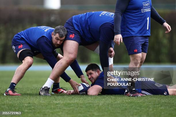 France's flanker Francois Cros and France's hooker Julien Marchand take part in a training session of France's rugby union national team ahead of...