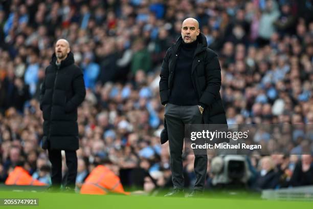 Pep Guardiola, Manager of Manchester City, looks on during the Premier League match between Manchester City and Manchester United at Etihad Stadium...