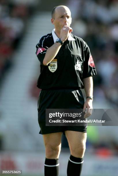 August 28: Mike Dean, FIFA Referee blows whistle during the Premier League match between Middlesbrough and Crystal Palace at Riverside Stadium on...