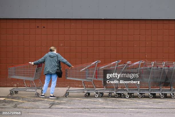Shopper pushes a cart outside a BJ's Wholesale Club location in Albany, New York, US, on Monday, March 4, 2024. BJ's Wholesale Club Holdings Inc. Is...