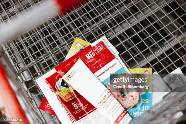 Book of coupons in a cart outside a BJ's Wholesale Club location in Albany, New York, US, on Monday, March 4, 2024. BJ's Wholesale Club Holdings Inc....