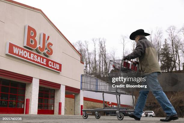 Shopper pushes a cart outside a BJ's Wholesale Club location in Rotterdam, New York, US, on Monday, March 4, 2024. BJ's Wholesale Club Holdings Inc....