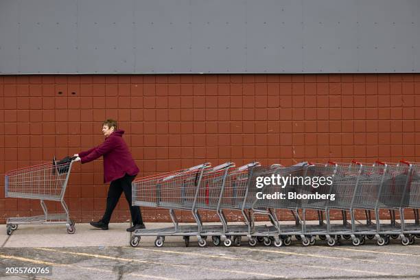 Shopper pushes a cart outside a BJ's Wholesale Club location in Albany, New York, US, on Monday, March 4, 2024. BJ's Wholesale Club Holdings Inc. Is...