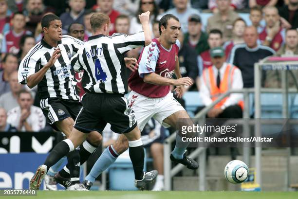August 28: Gavin Mccann of Aston Villa, Jermaine Jenas of Newcastle United and Nicky Butt of Newcastle United challenge during the Premier League...