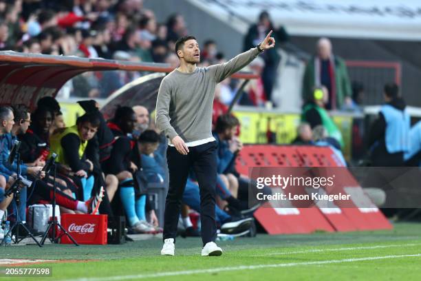 Xabi Alonso, Manager of Bayer Leverkusen, reacts during the Bundesliga match between 1. FC Köln and Bayer 04 Leverkusen at RheinEnergieStadion on...