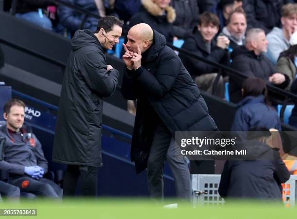 Pep Guardiola, Manager of Manchester City, reacts whilst interacting with Fourth Official Darren England during the Premier League match between...