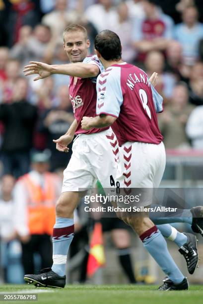 August 28: Olof Mellberg and Gavin Mccann of Aston Villa celebrate during the Premier League match between Aston Villa and Newcastle United at Villa...