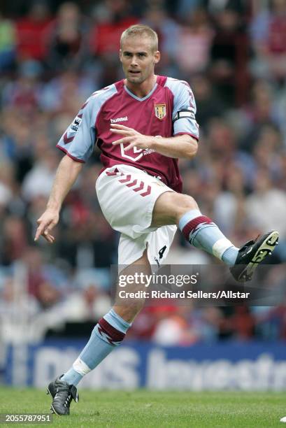 August 28: Olof Mellberg of Aston Villa kicking during the Premier League match between Aston Villa and Newcastle United at Villa Park on August 28,...