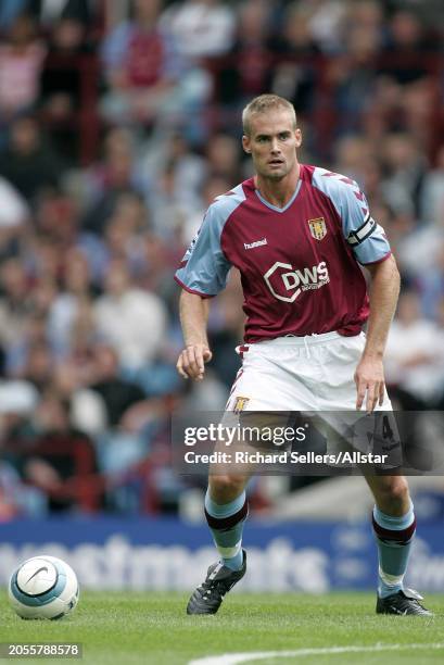 August 28: Olof Mellberg of Aston Villa on the ball during the Premier League match between Aston Villa and Newcastle United at Villa Park on August...