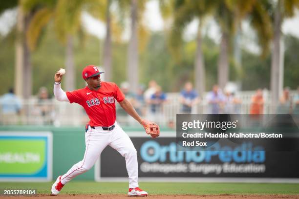 Enmanuel Valdez of the Boston Red Sox throws to first for an out during a Grapefruit League Spring Training game against the Washington Nationals at...