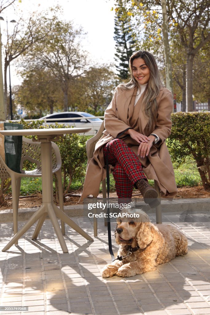 Independent woman smiling with Cocker Spaniel dog