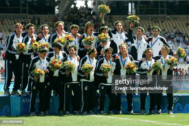 August 28: Argentina players with Olympic Gold Medals after the Mens Football Gold Contest Olympic Final match between Argentina and Paraguay at...