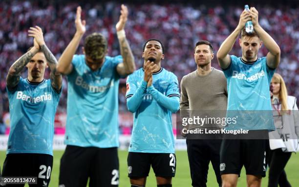 Xabi Alonso, Manager of Bayer Leverkusen, looks on as players of Bayer Leverkusen acknowledge the fans after the Bundesliga match between 1. FC Köln...