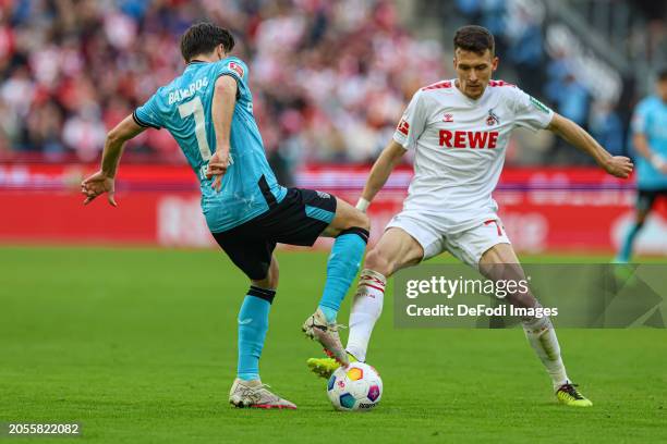 Jonas Hofmann of Bayer 04 Leverkusen and Dejan Ljubicic of 1. FC Koeln battle for the ball during the Bundesliga match between 1. FC Köln and Bayer...