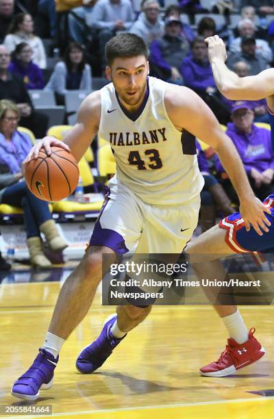 University at Albany's Greig Stire drives to the basket during a basketball game against Lowell at SEFCU Arena on Thursday, Jan. 18, 2018 in Albany,...