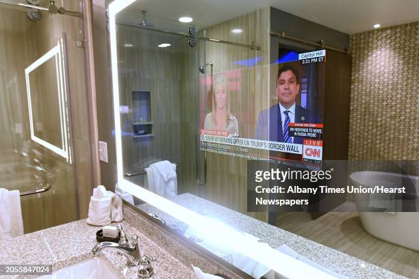 Mirror with a built in television in the master bathroom in The Plaza Suite at Franklin Square Inn on Monday, Jan. 22, 2018 in Troy, N.Y.
