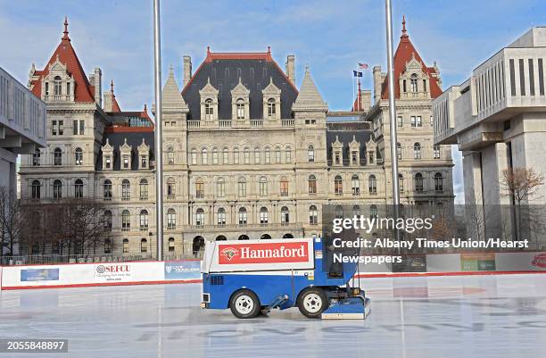 New York State Office of General Services worker Robert Blanchard drives the Zamboni to smooth the ice rink at the Empire State Plaza on Wednesday,...