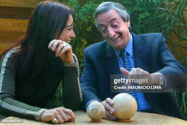 Presidential candidate Néstor Kirchner is seen talking to the press alongside his wife Cristina Fernandez de Kirchner in Rio Gallegos, Argentina 28...