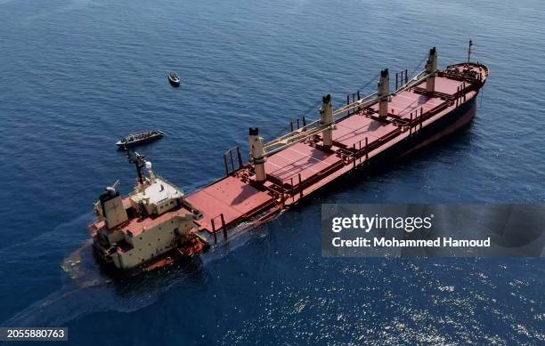 This handout photo provided by Yemeni Al-Joumhouria TV, shows the British-registered cargo ship 'Rubymar' sinking, after it was targeted by Yemen's...