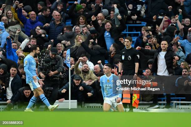 Phil Foden of Manchester City celebrates scoring his team's second goal during the Premier League match between Manchester City and Manchester United...