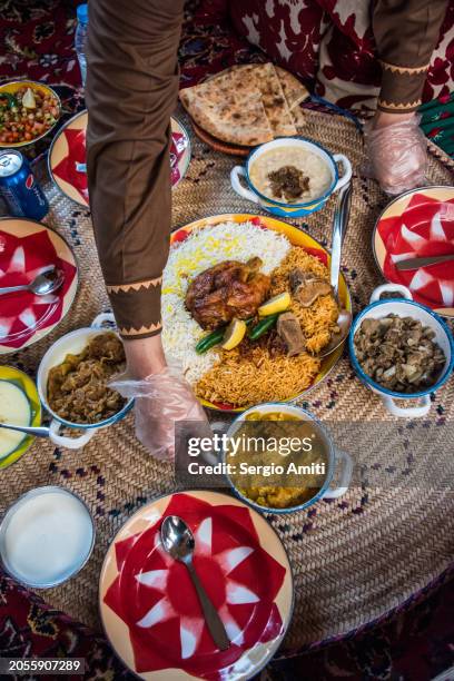 serving saudi chicken kabsa, goursan, hamees and margoog - food and drink stock pictures, royalty-free photos & images