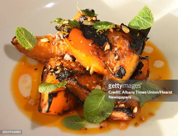 Ash roasted kuri squash, coal burnt paprika oil, dukkah spices, lime, mint at Silvia restaurant on Tuesday, Feb. 13, 2018 in Woodstock, N.Y.