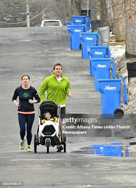 Kristi and Nathaniel Doro of Albany run with their 16-month-old daughter Vita on Lenox Ave. On Thursday, Feb. 15, 2018 in Albany, N.Y. Nathaniel was...